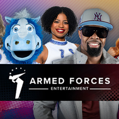 Artist, cheerleader, and a mascot clustered together, smiling and posing for a photo behind an overlay of the Armed Forces Entertainment logo.