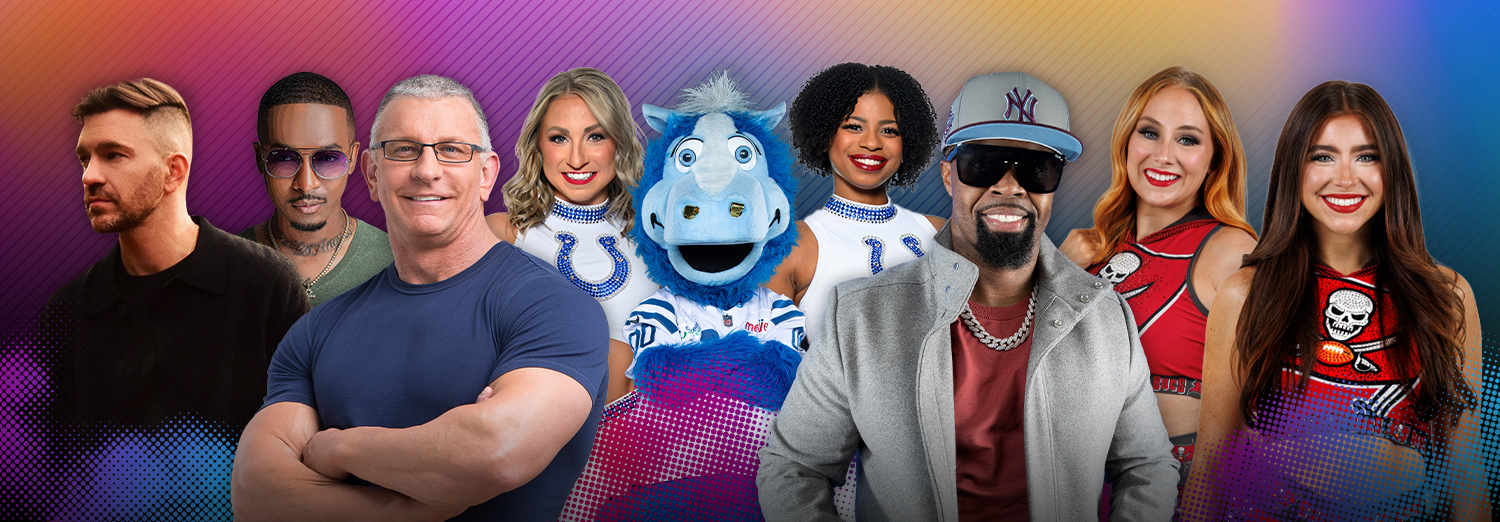 Artists, performers, a mascot, dancers, and cheerleaders clustered together, smiling and posing for a photo.