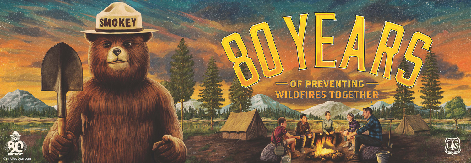 Banner featuring Smokey the Bear holding a shovel next to overlaid text '80 Years of Preventing Wildfires Together.' People sit around a campfire in a forest setting with mountains in the background. This banner is published by the U.S. Forest Service.