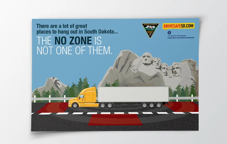 Ad published for the NHTSA Public Health Ad campaign showing an 18-wheeler driving on a road with Mount Rushmore in the background with an overlay of text that reads 'There are a lot of great places to hang out in South Dakota…The No Zone is not one of them.'