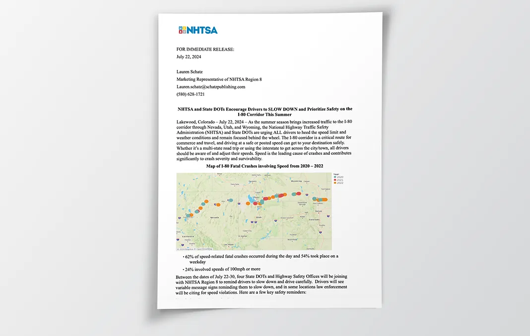 Sample press release titled 'NHTSA and State DOTs Encourage Drivers to SLOW DOWN and Prioritize Safety on the I-80 Corridor This Summer' published by Lauren Schatz, the Marketing Representative of NHTSA Region 8.